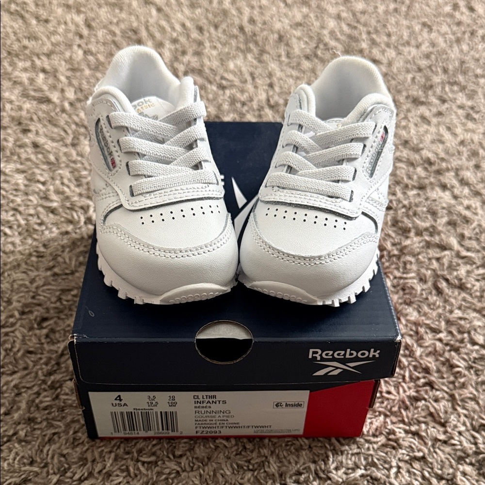 Infant size 4 brand new all white classic reeboks. Box included